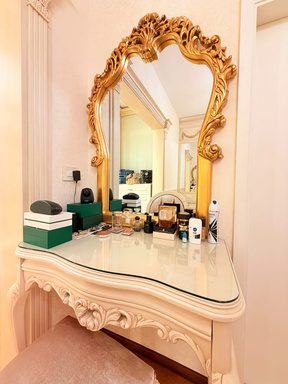 Executed vanity with gilded mirror